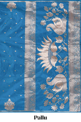 Blue colour Semi soft silk withgold zari floral motifs border with peacock motifs and matching blouse