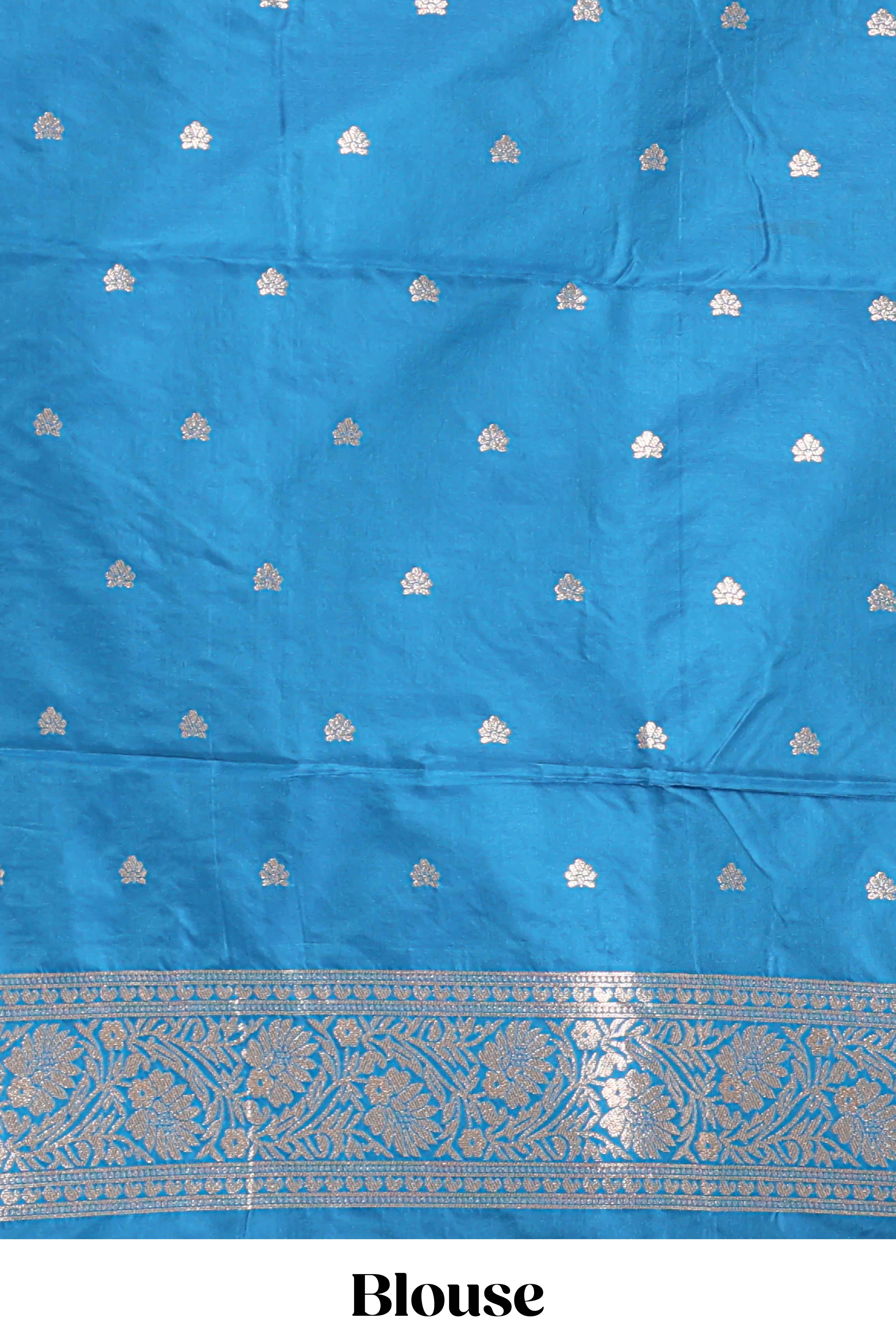 Blue colour Semi soft silk withgold zari floral motifs border with peacock motifs and matching blouse