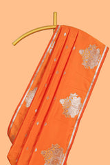 Orange colour Semi soft silk withgold zari floral motifs border with peacock motifs and matching blouse