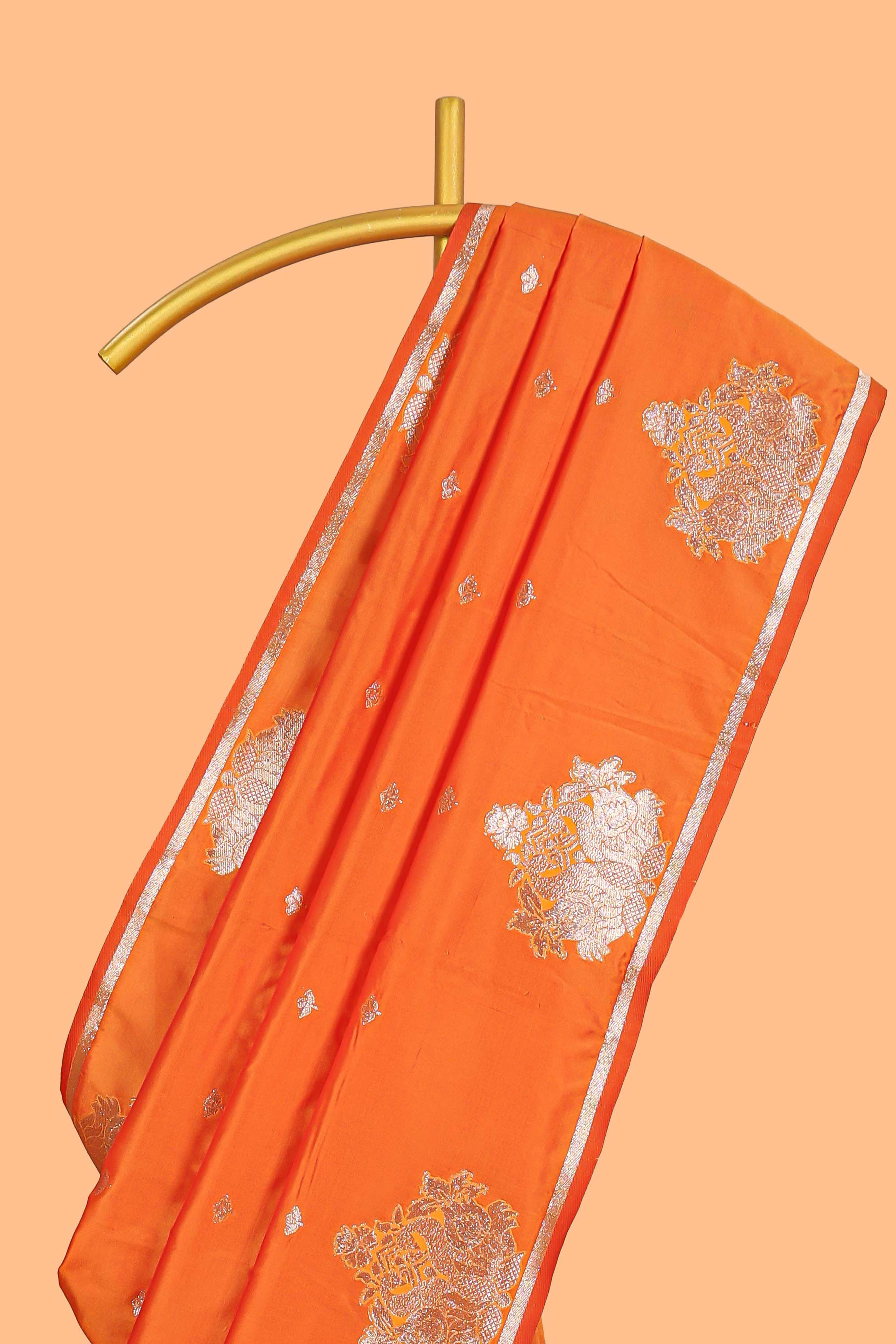 Orange colour Semi soft silk withgold zari floral motifs border with peacock motifs and matching blouse