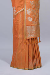 Light orange floral zari motifs design semi soft silk saree with self border and matching blouse