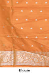 Rust Orange colour Semi soft silk withgold zari floral motifs border with peacock motifs and matching blouse