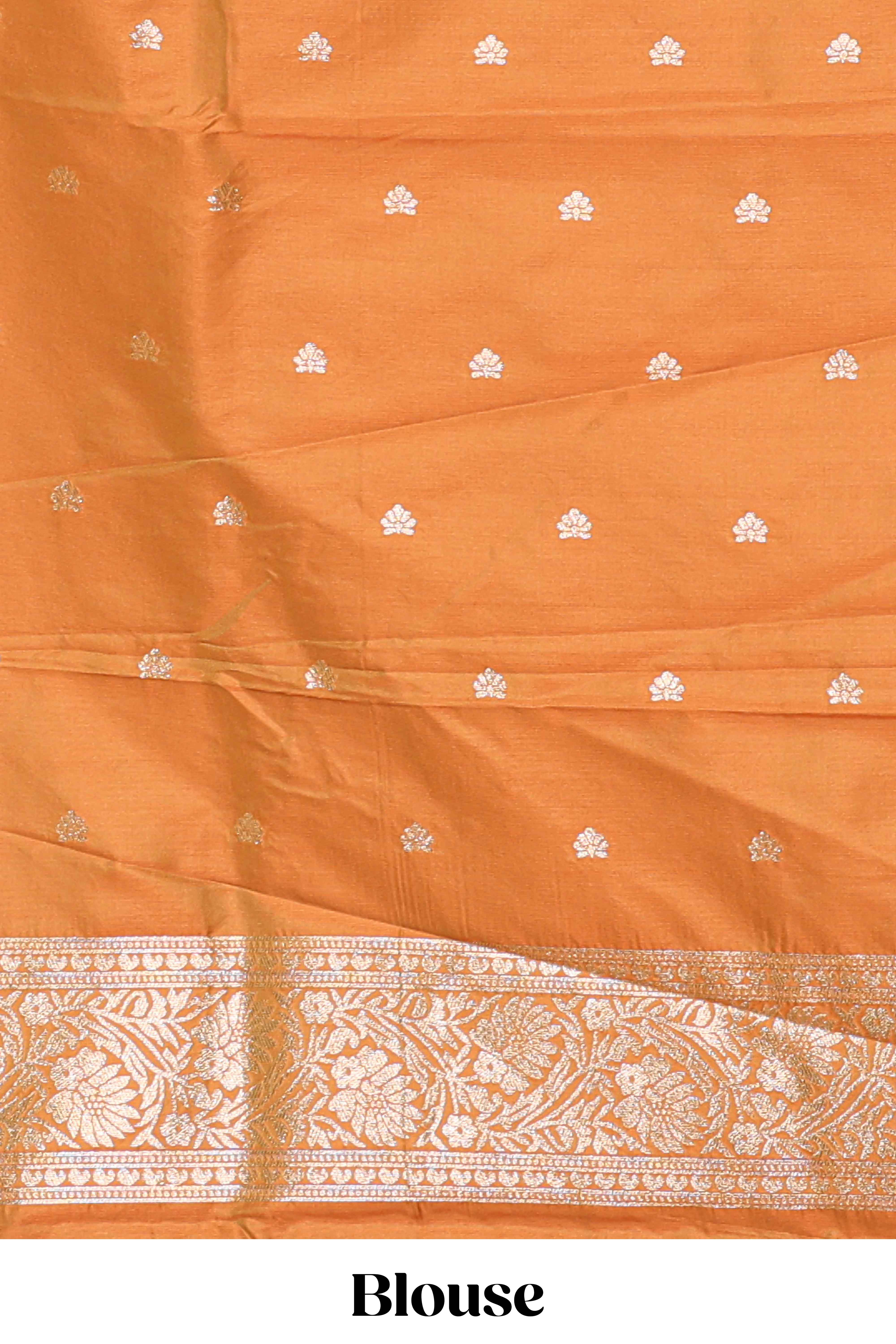 Rust Orange colour Semi soft silk withgold zari floral motifs border with peacock motifs and matching blouse