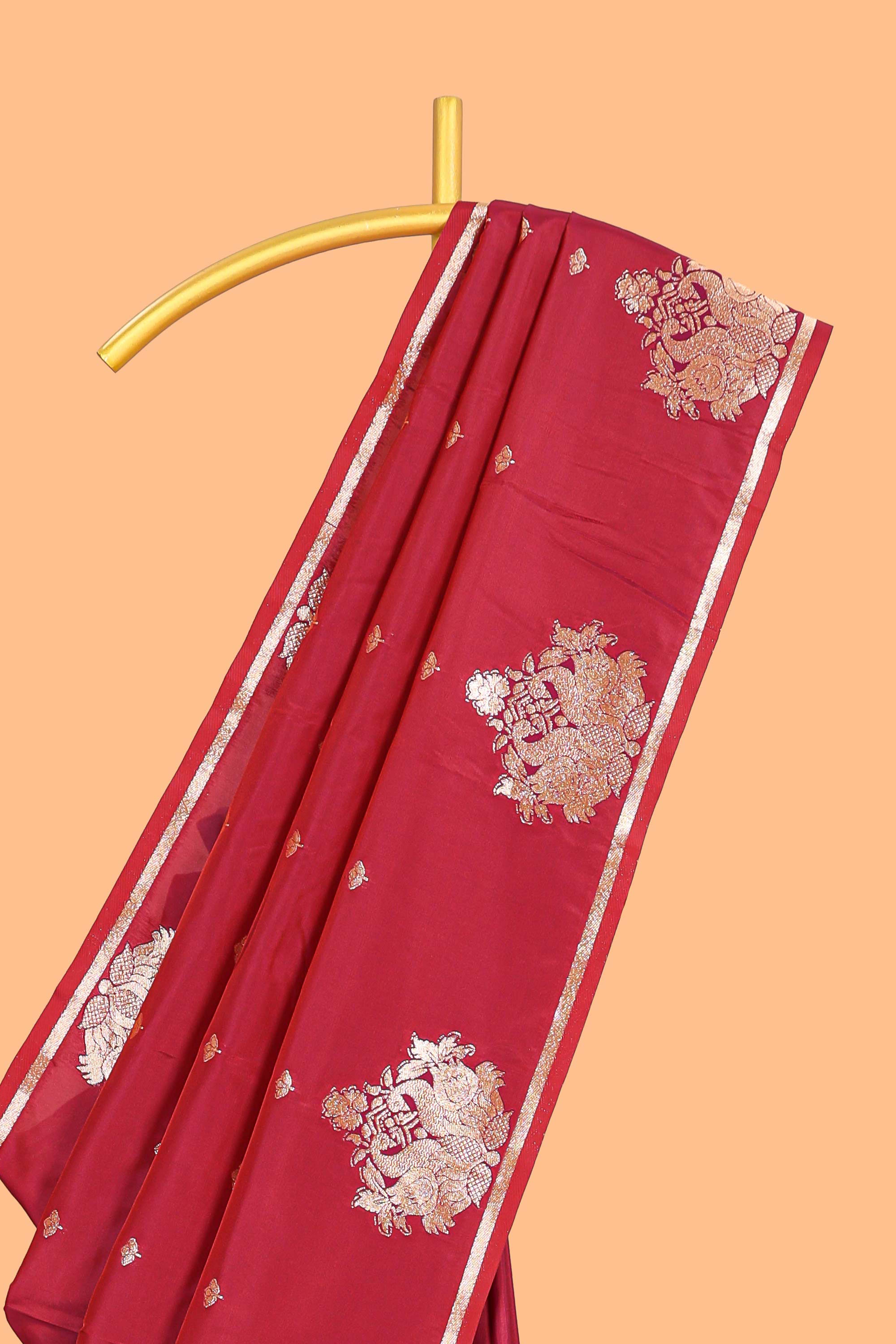 Red colour Semi soft silk withgold zari floral motifs border with peacock motifs and matching blouse