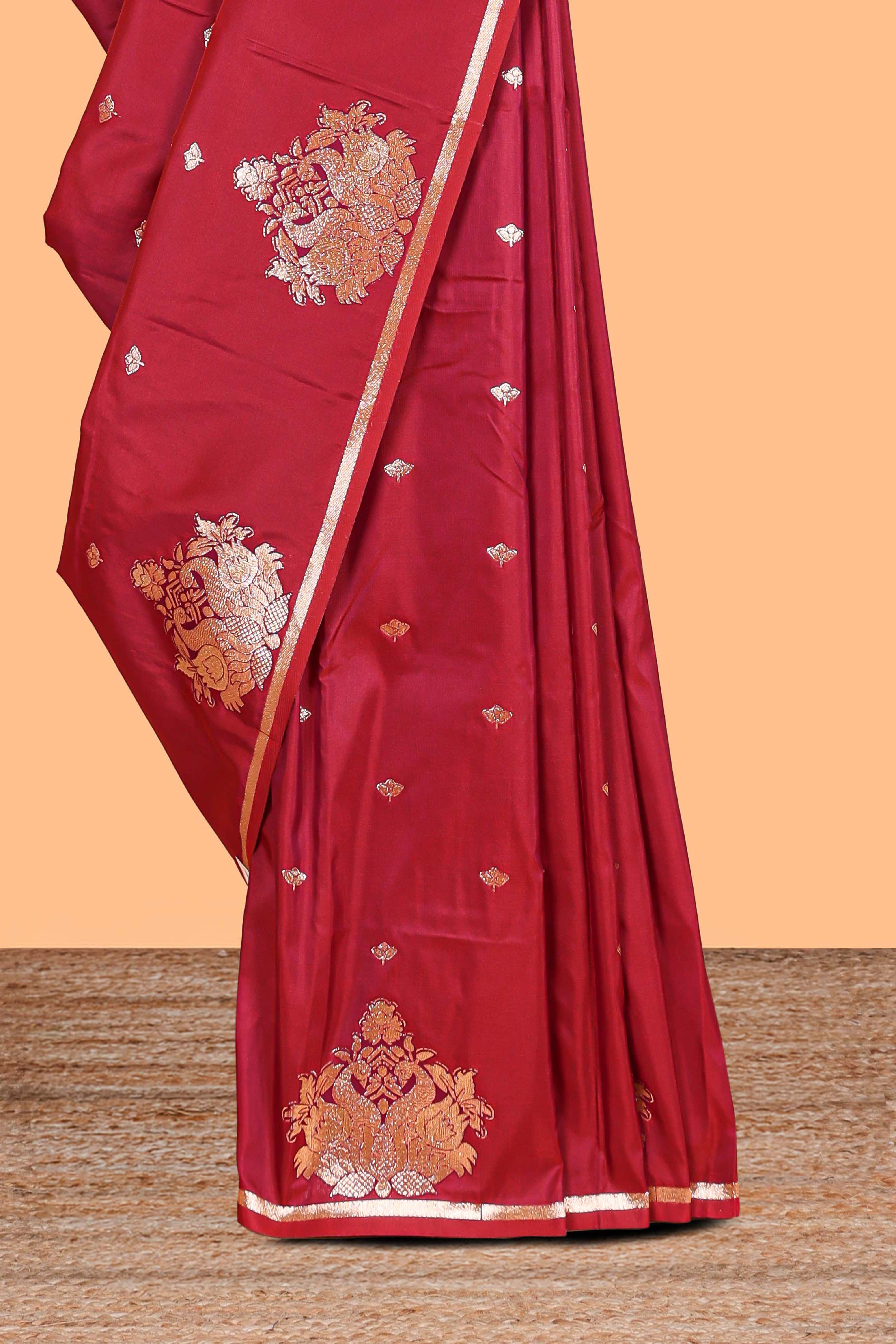 Red colour Semi soft silk withgold zari floral motifs border with peacock motifs and matching blouse