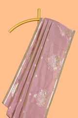 Peach colour Semi soft silk withgold zari floral motifs border with peacock motifs and matching blouse