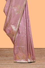 Peach colour Semi soft silk withgold zari floral motifs border with peacock motifs and matching blouse