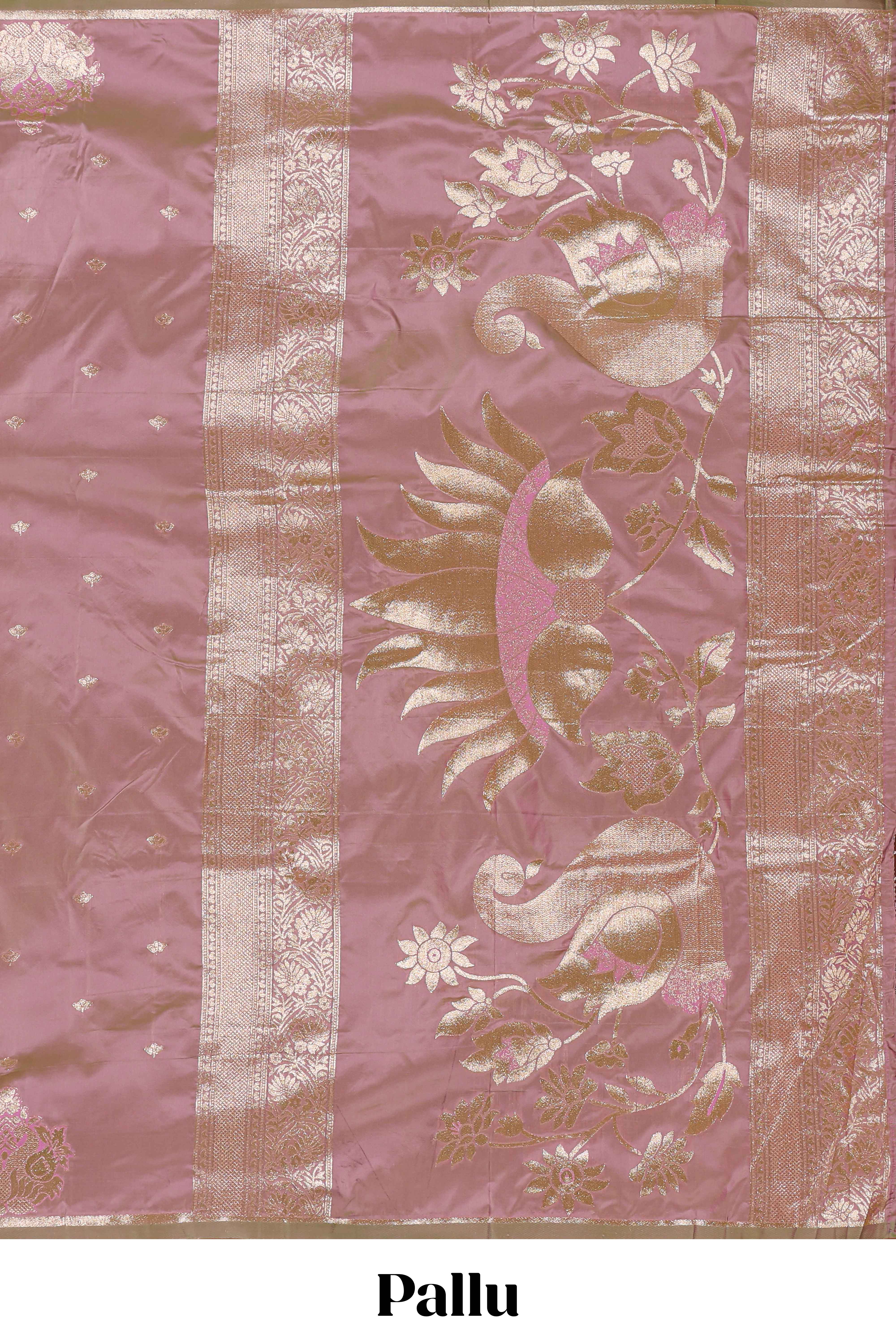 Peach colour Semi soft silk withgold zari floral motifs border with peacock motifs and matching blouse