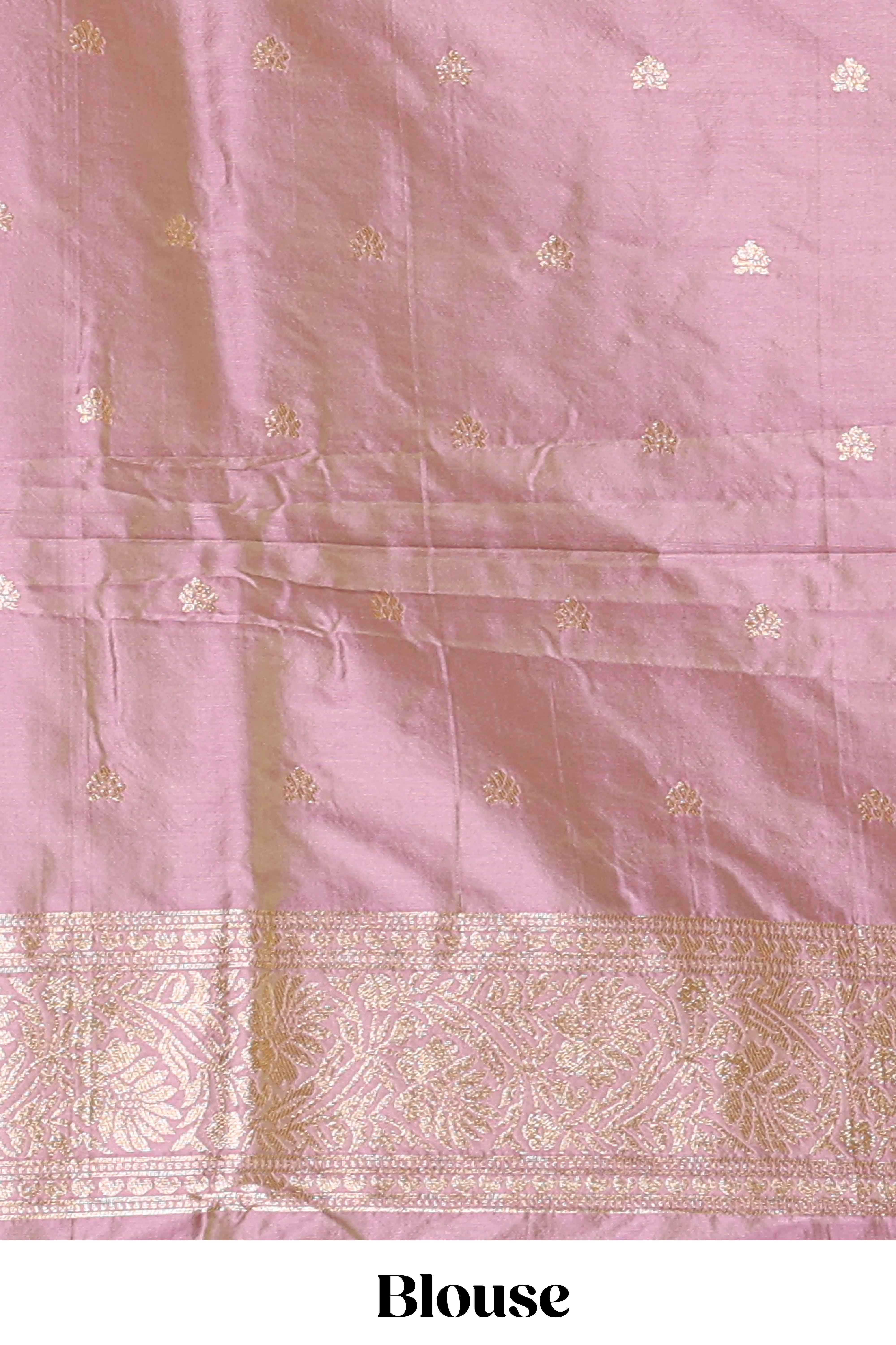 Peach colour Semi soft silk withgold zari floral motifs border with peacock motifs and matching blouse
