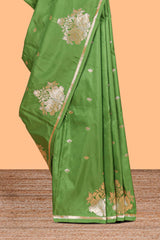 Green colour Semi soft silk withgold zari floral motifs border with peacock motifs and matching blouse