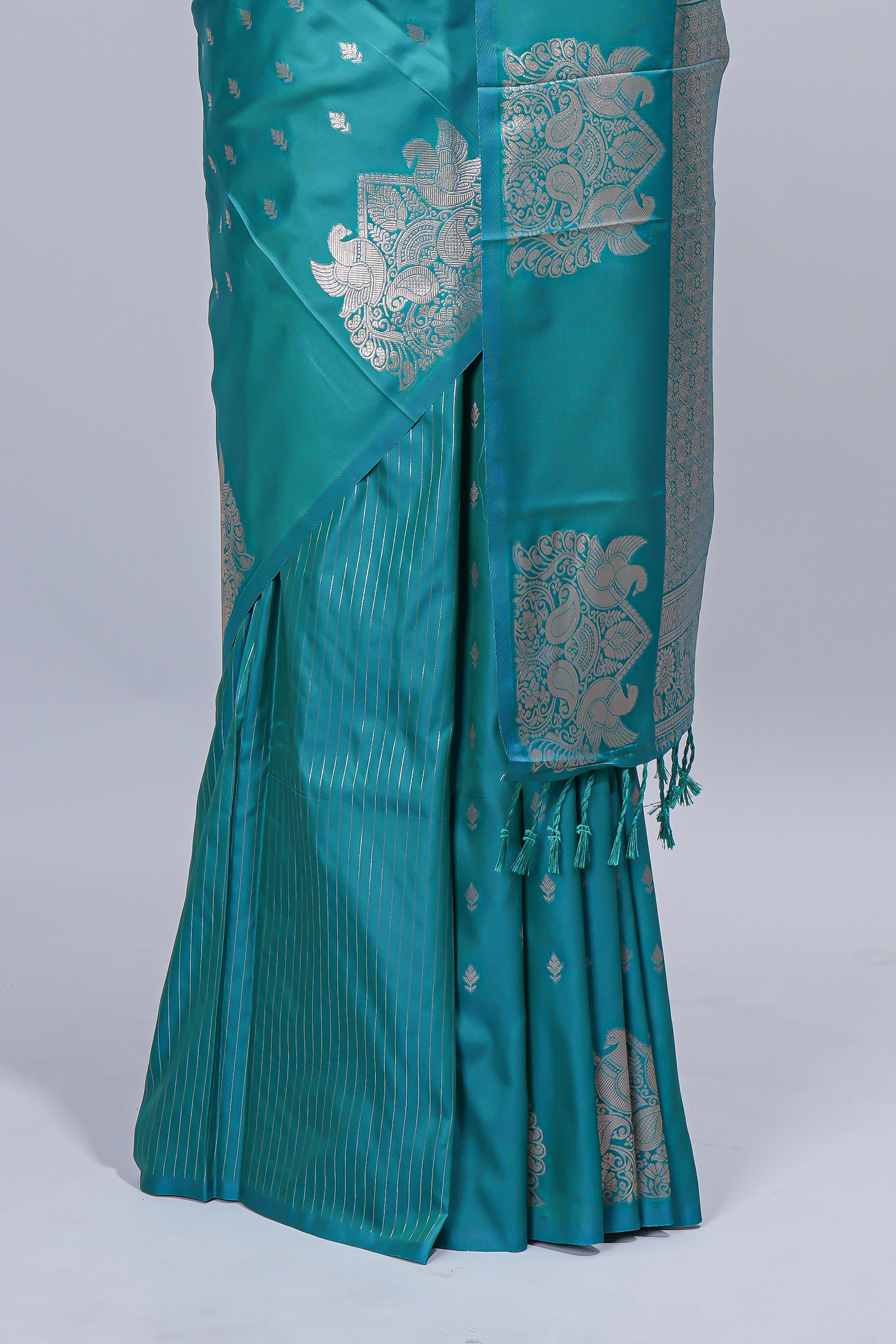 Green floral zari motifs design semi soft silk saree with self border and matching blouse