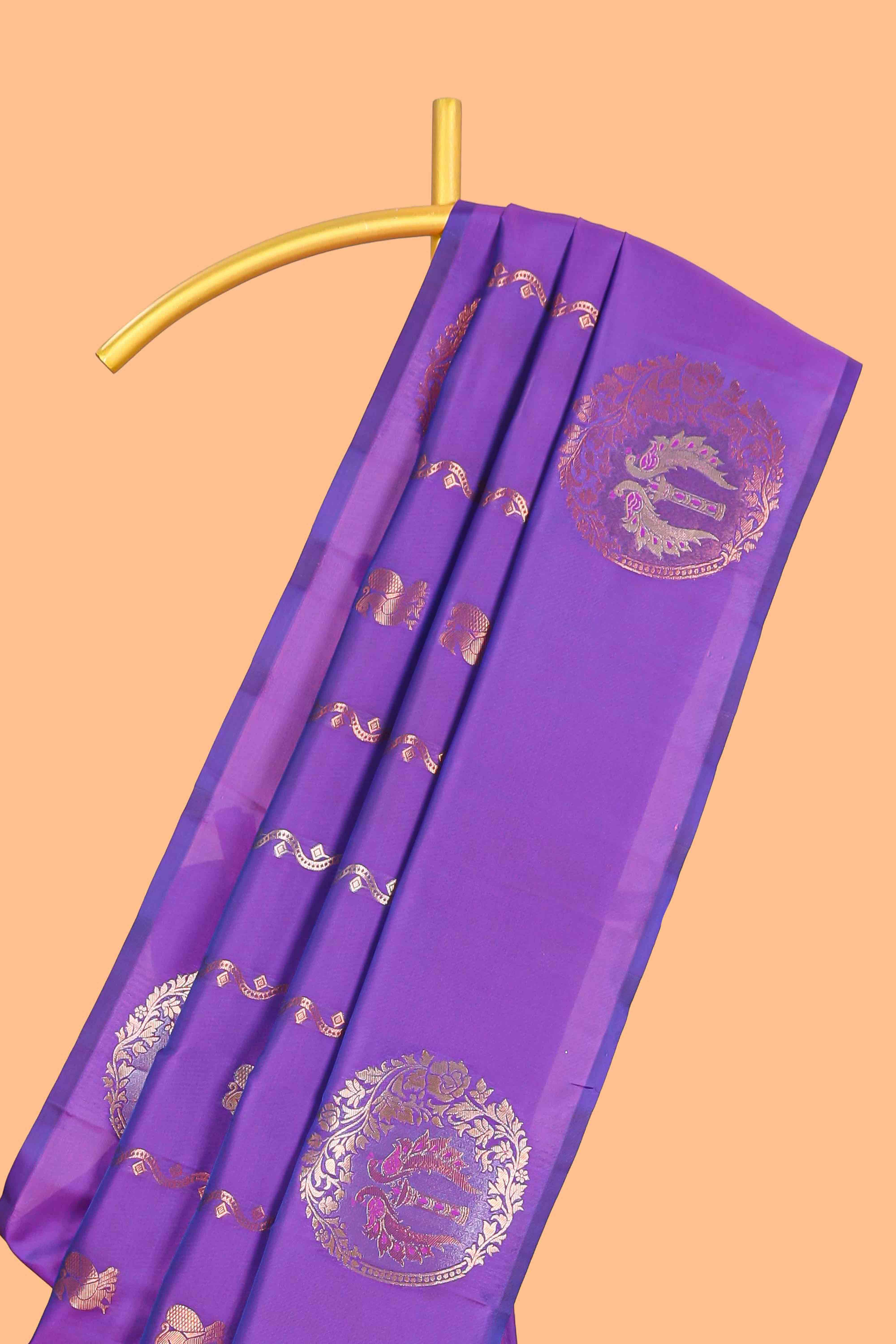 Violet colour Semi soft silk withgold zari floral motifs border with Vaira oosi Design and matching blouse