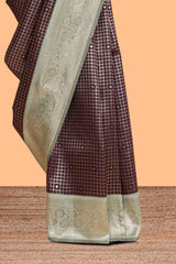 Dark brown checked floral motifs design semi soft silk saree with contrast border and blouse