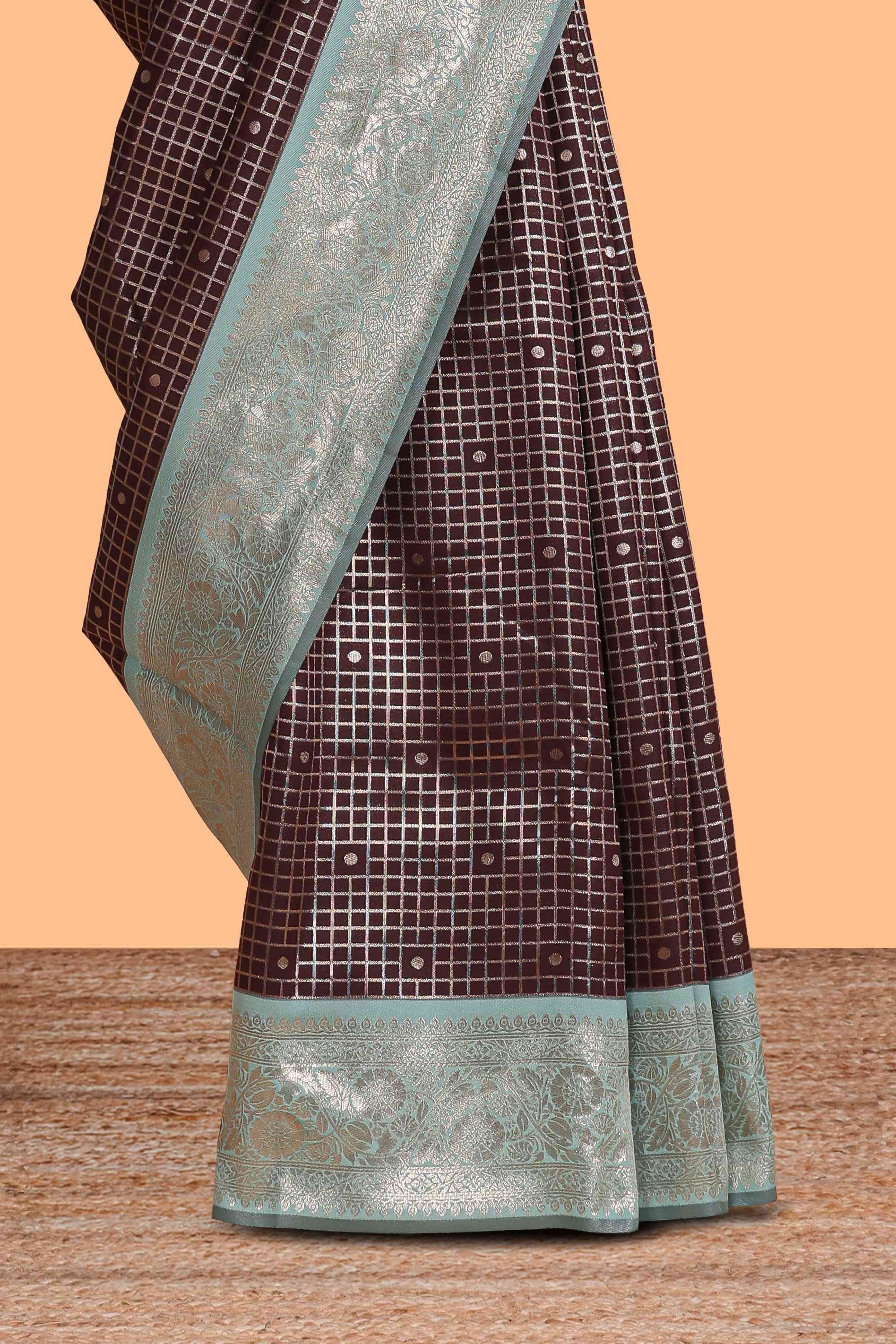 Dark brown checked floral motifs design semi soft silk saree with contrast border and blouse