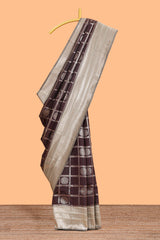 Dark brown checked floral motifs design semi soft silk saree with contrast border and blouse