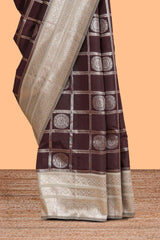 Dark brown checked floral motifs design semi soft silk saree with contrast border and blouse