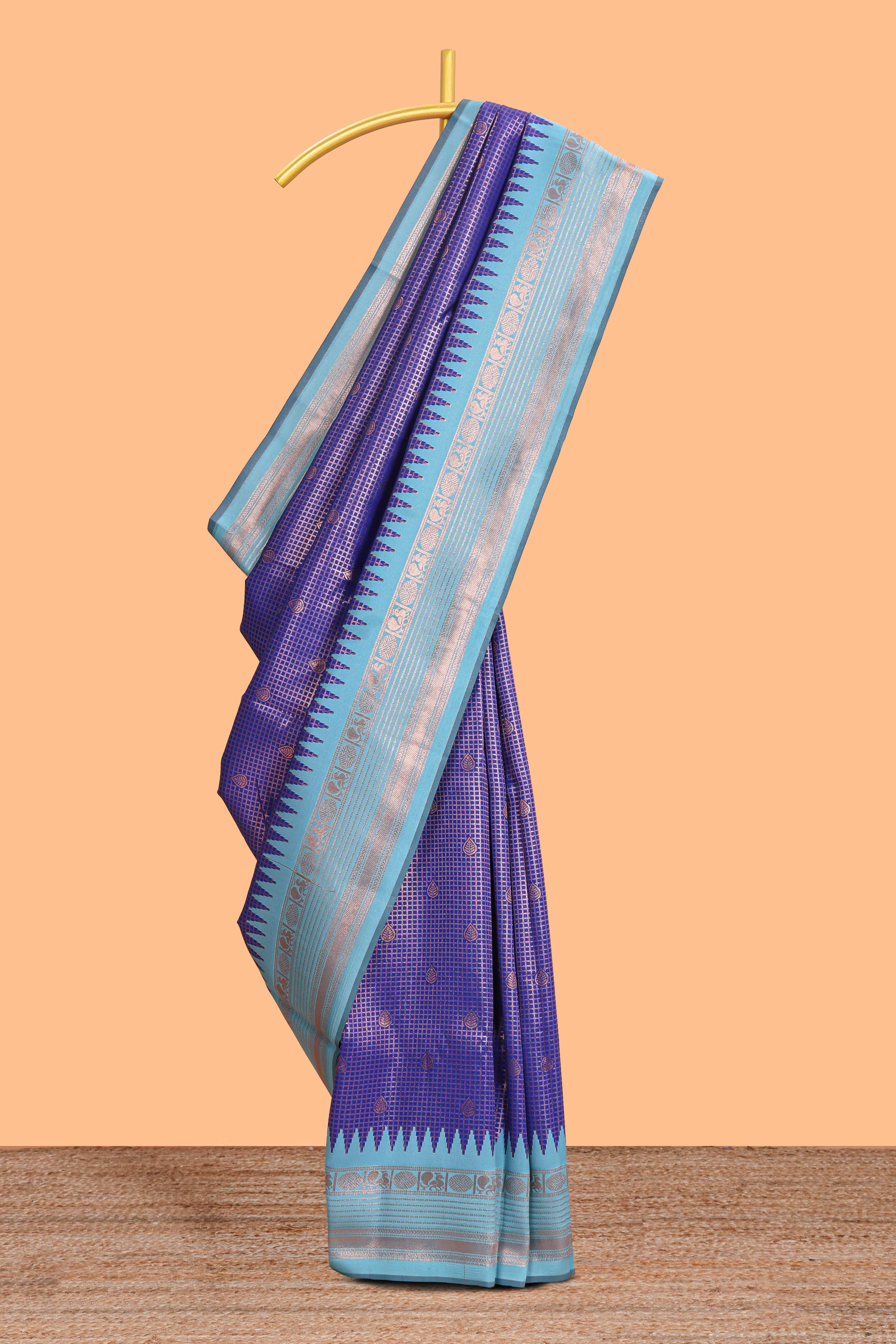 Blue checked floral motifs design semi soft silk saree with contrast border and blouse