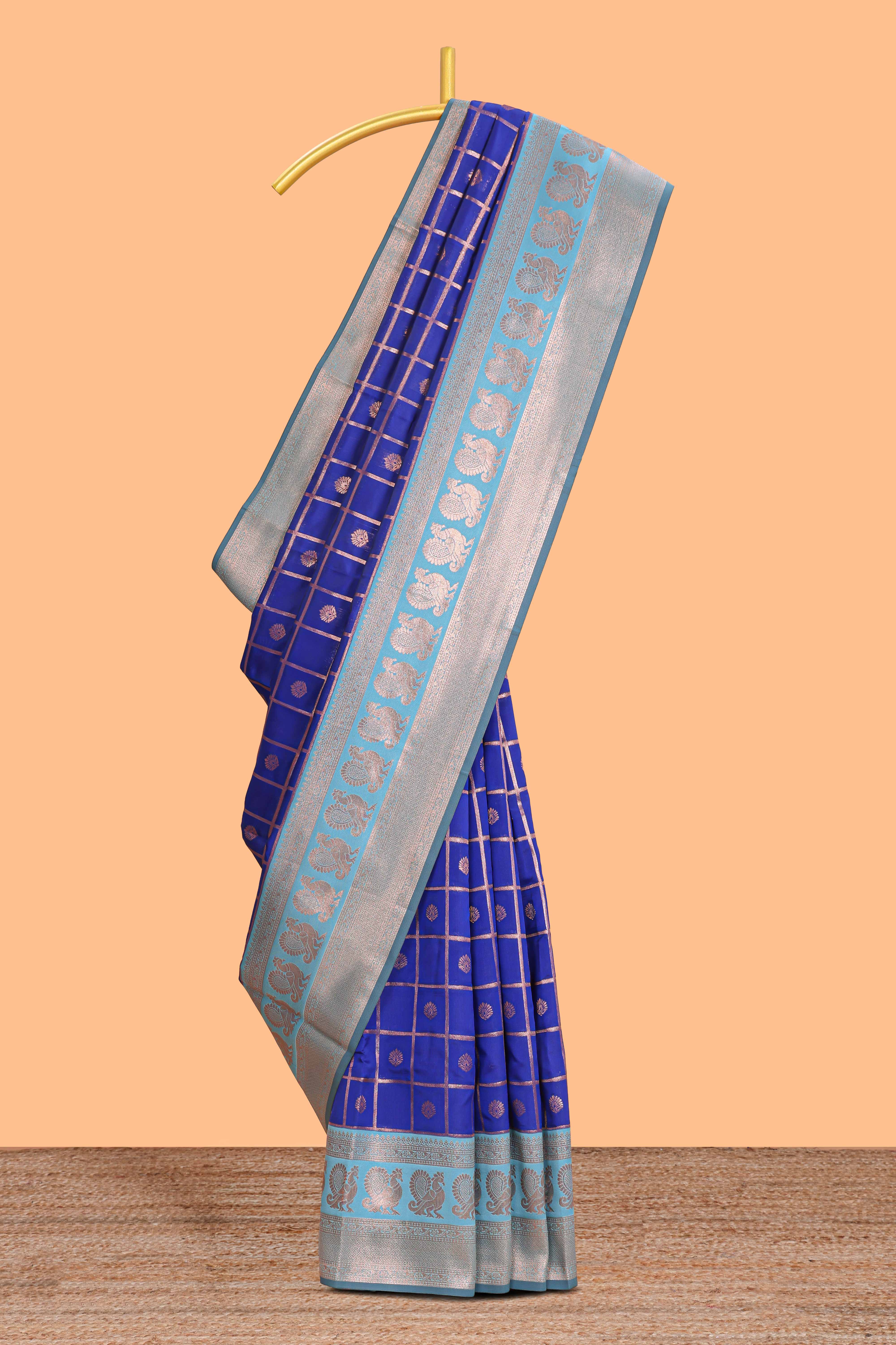 Blue checked floral motifs design semi soft silk saree with contrast border and blouse