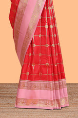 Red checked floral zari design semi soft silk saree with contrast bentex border and floral motifs blouse