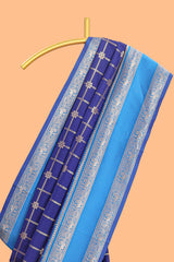 Blue checked floral zari design semi soft silk saree with contrast bentex border and floral motifs blouse