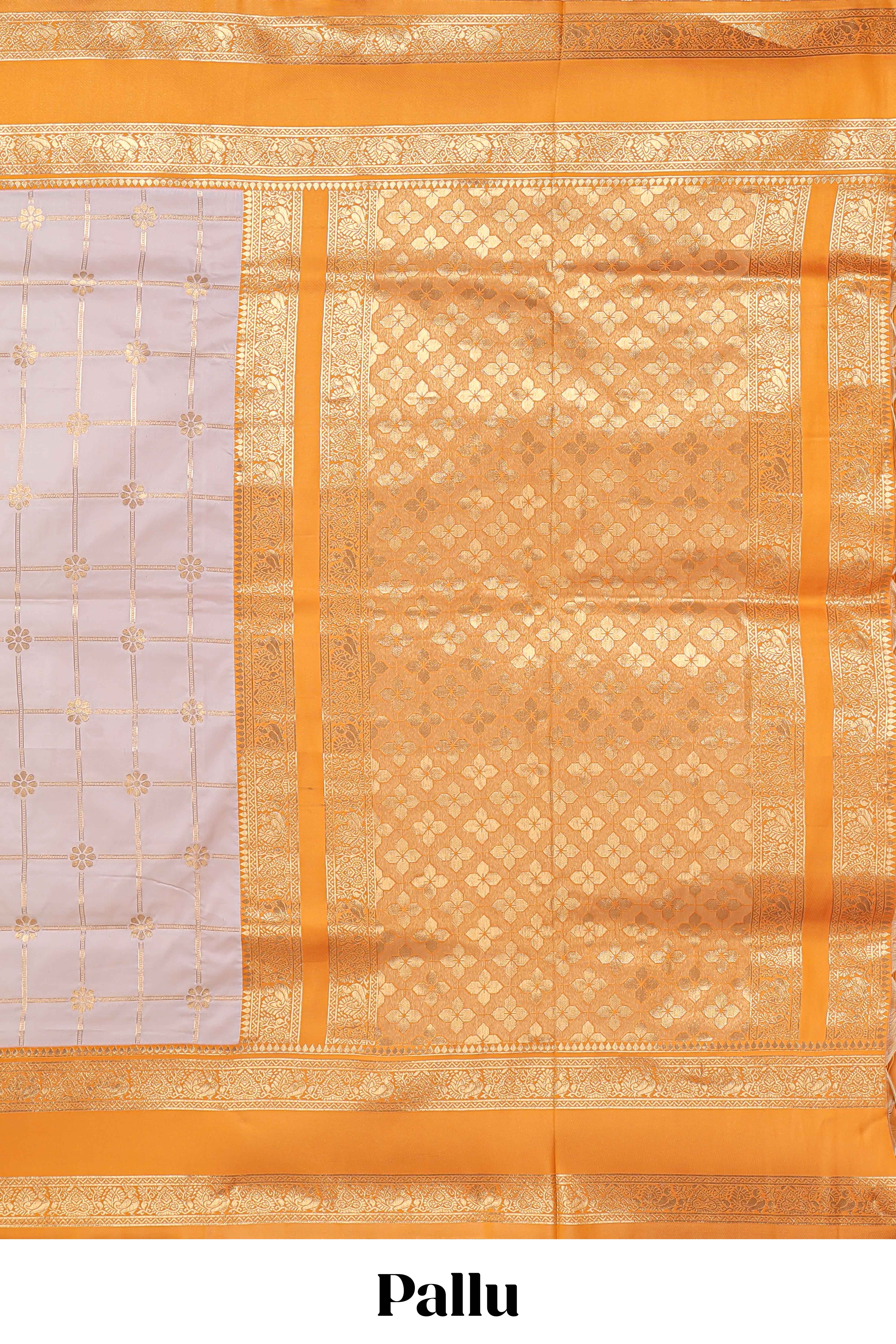 Cream checked floral zari design semi soft silk saree with contrast bentex border and floral motifs blouse
