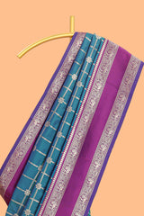 Green checked floral zari design semi soft silk saree with contrast bentex border and floral motifs blouse