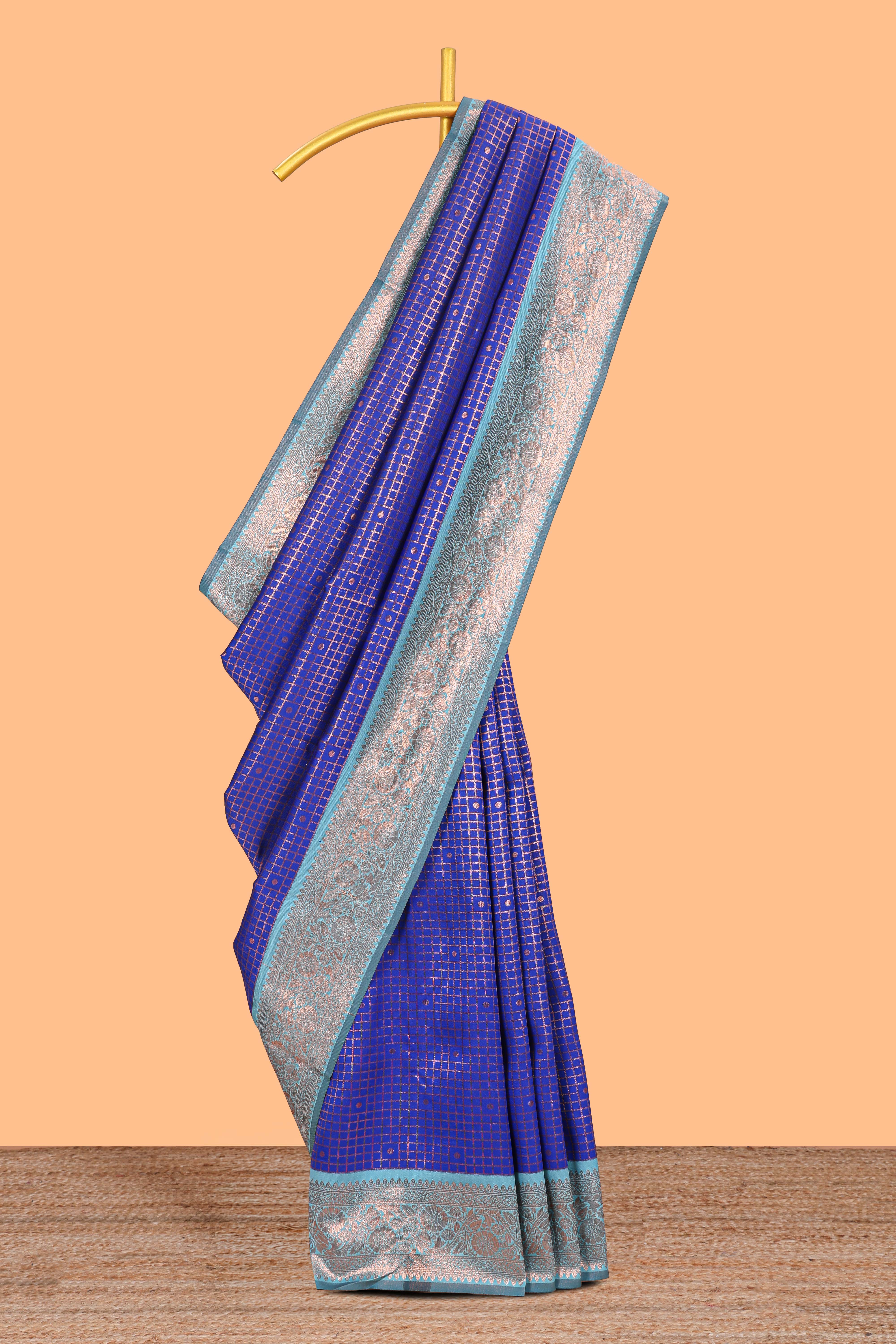 Blue checked & dotted motifs semi soft silk saree with contrast zari border and floral motifs blouse