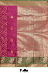 Magenta colour semi soft silk saree with contrast paisely border and contrast zari buttas blouse