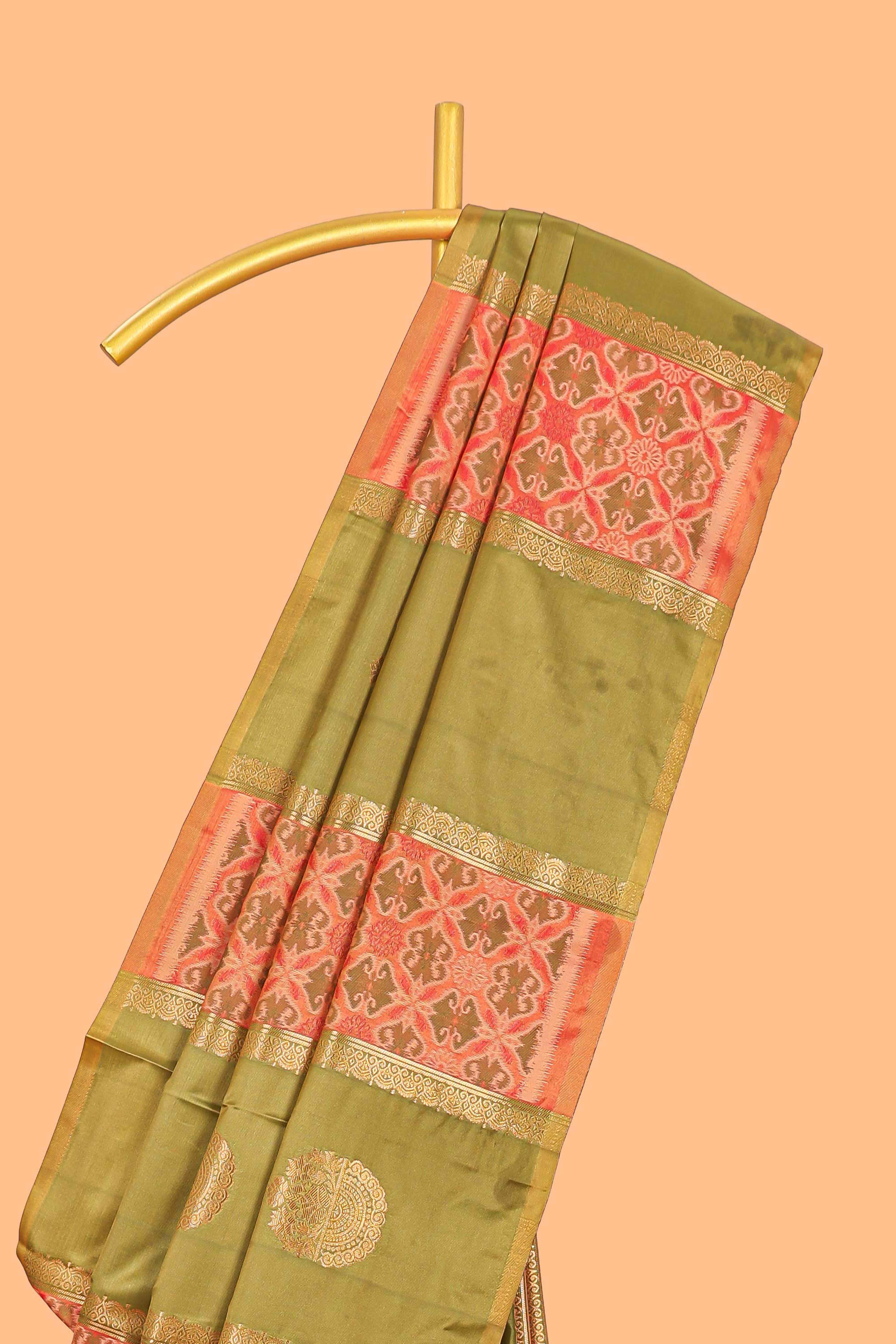 Green semi soft silk saree patola printed body with zari border and rich contrast pallu with contrast blouse