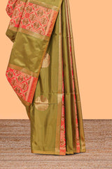 Green semi soft silk saree patola printed body with zari border and rich contrast pallu with contrast blouse