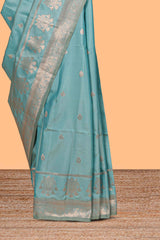 Sky blue semi soft silk saree silver motifs and matching floral zari border contrast pallu and blouse
