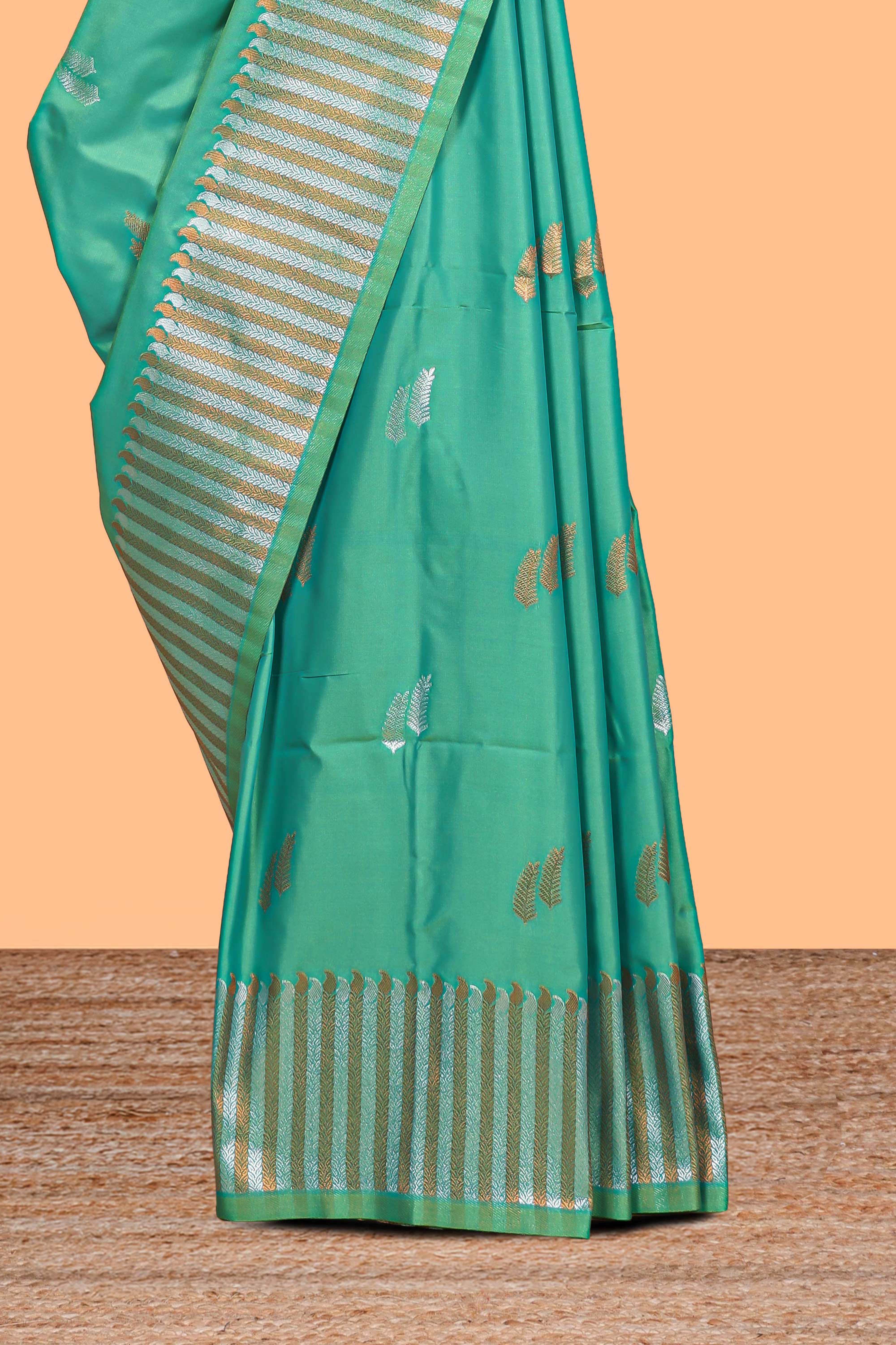 Green colour semi soft silk Woven Zari-Inspired Motifs and Geometric Weave Design border with contrast pallu and blouse