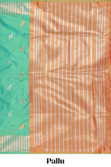 Green colour semi soft silk Woven Zari-Inspired Motifs and Geometric Weave Design border with contrast pallu and blouse