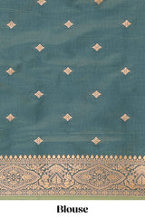 Green colour semi soft silk all over zari striped pattern with contrast zari weaving border and contrast buttas weaving blouse