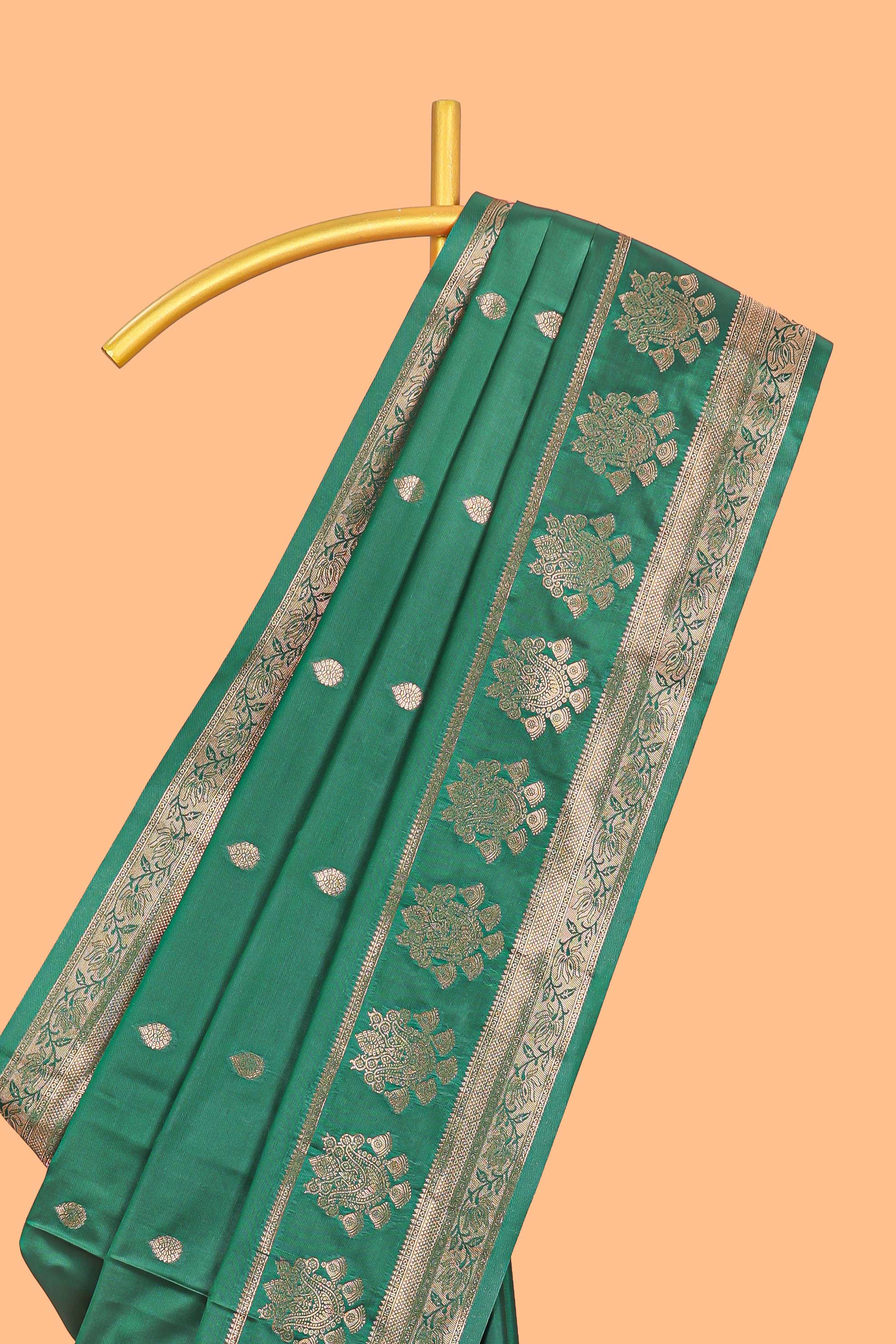 Bottle Green colour semi soft silk all over zari weave motifs with zari weaving border and contrast buttas weaving blouse