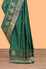 Bottle Green colour semi soft silk all over zari weave motifs with zari weaving border and contrast buttas weaving blouse