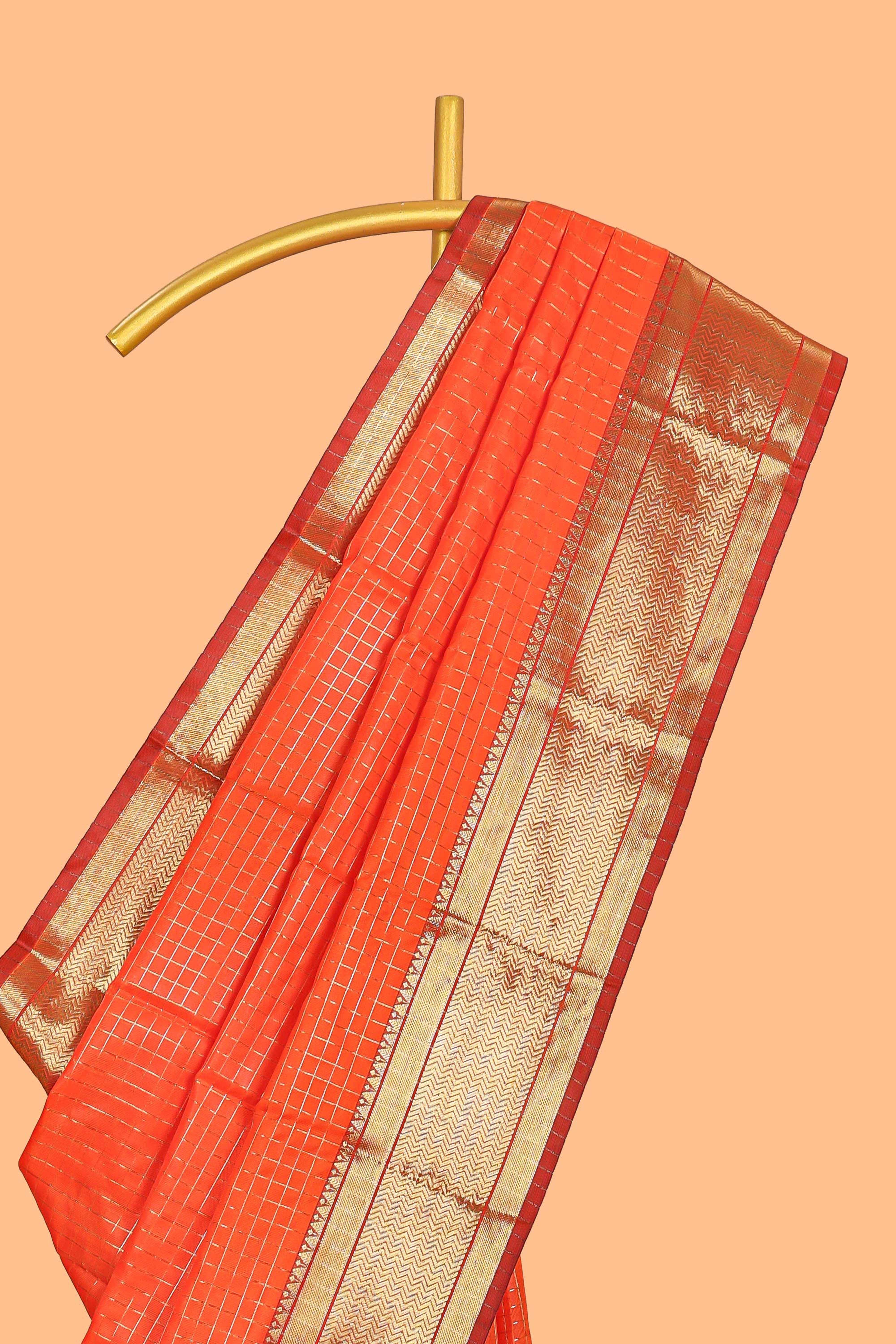 Orange colour semi soft silk all over checked pattern andContrast zari weaving border and contrastblouse