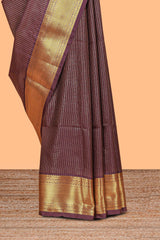 Brown colour semi soft silk all over checked pattern andContrast zari weaving border and Matching blouse