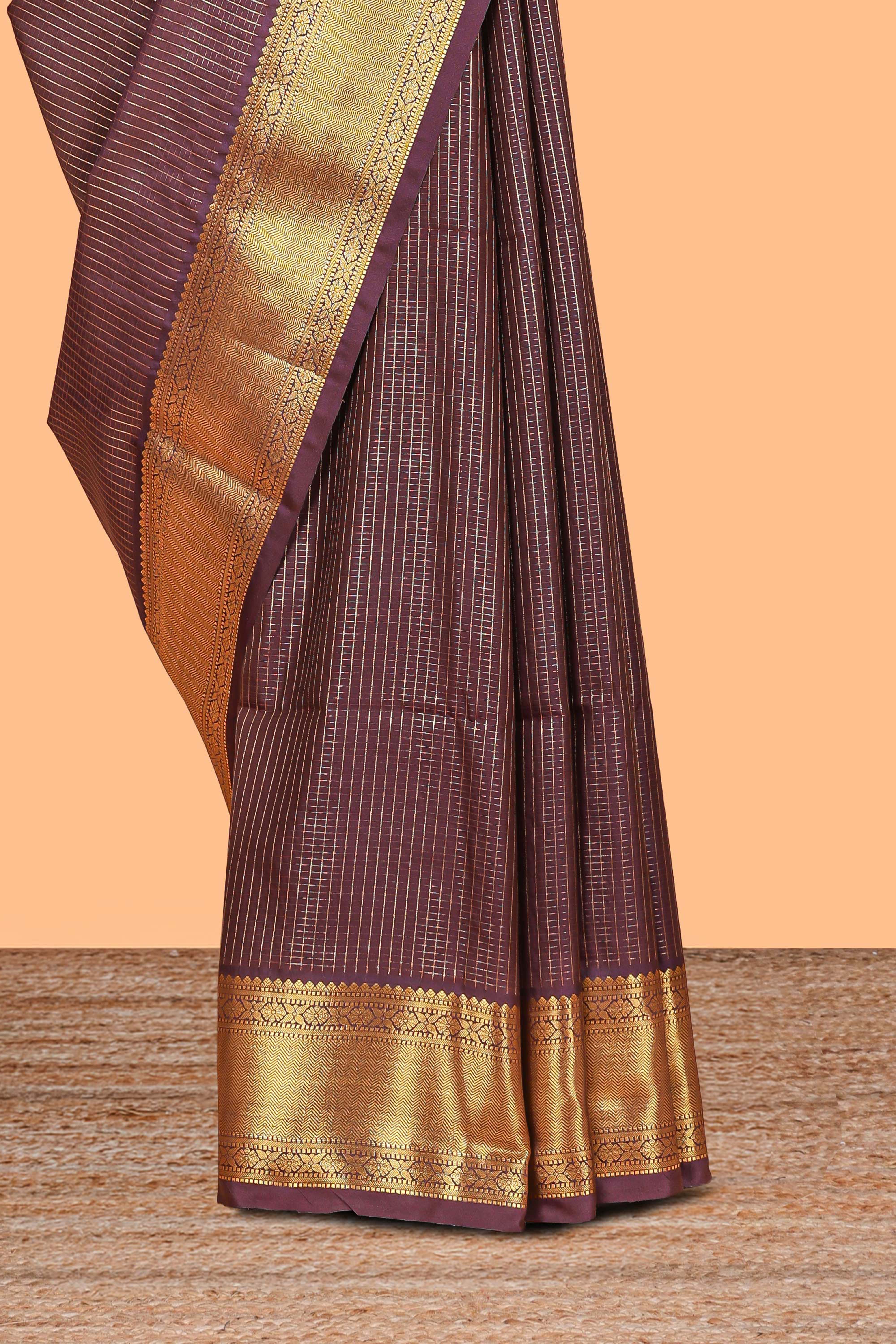 Brown colour semi soft silk all over checked pattern andContrast zari weaving border and Matching blouse