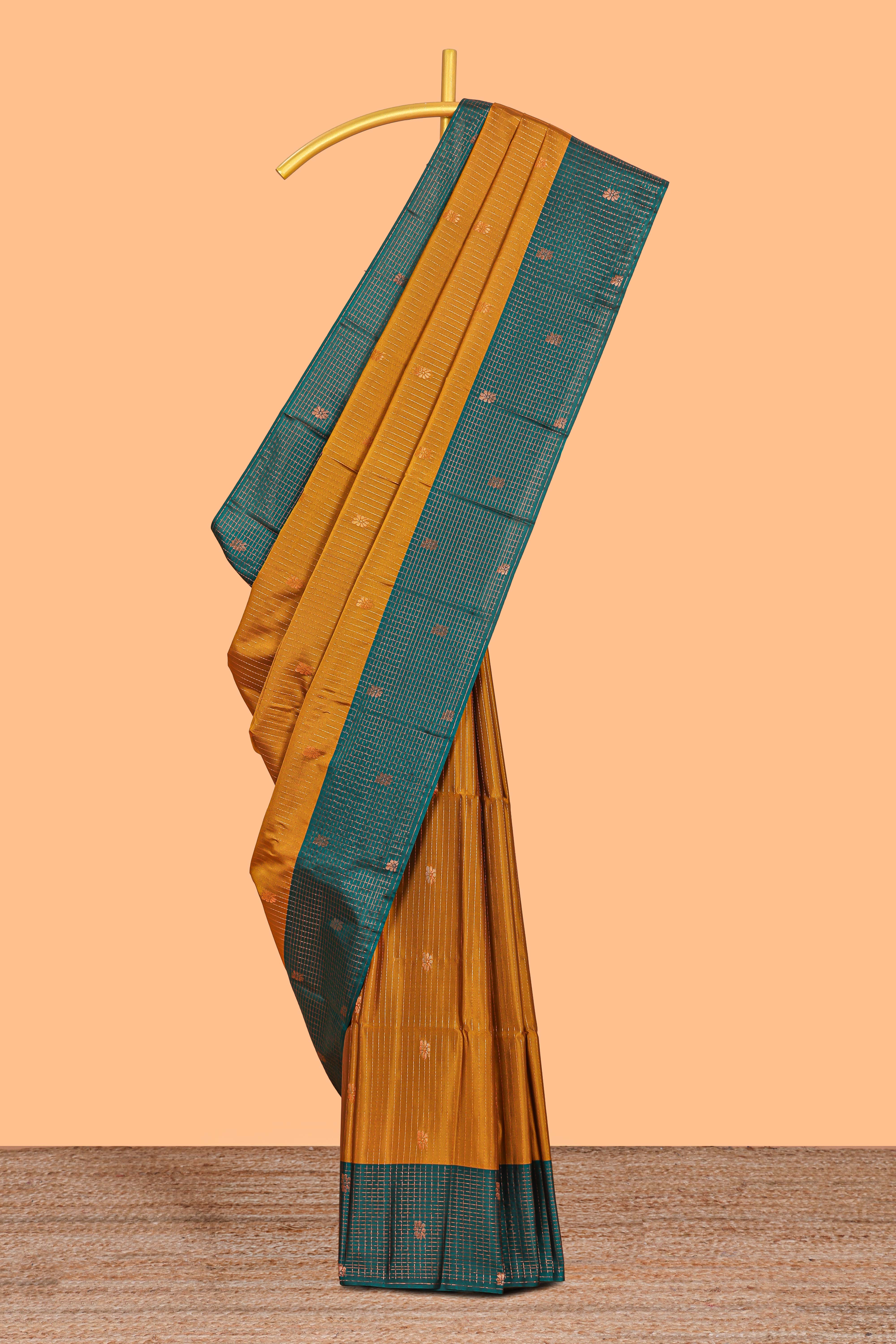 Mustard Yellow colour semi soft silk all over thread weave flower and stripes pattern with Contrast border and contrast buttas blouse