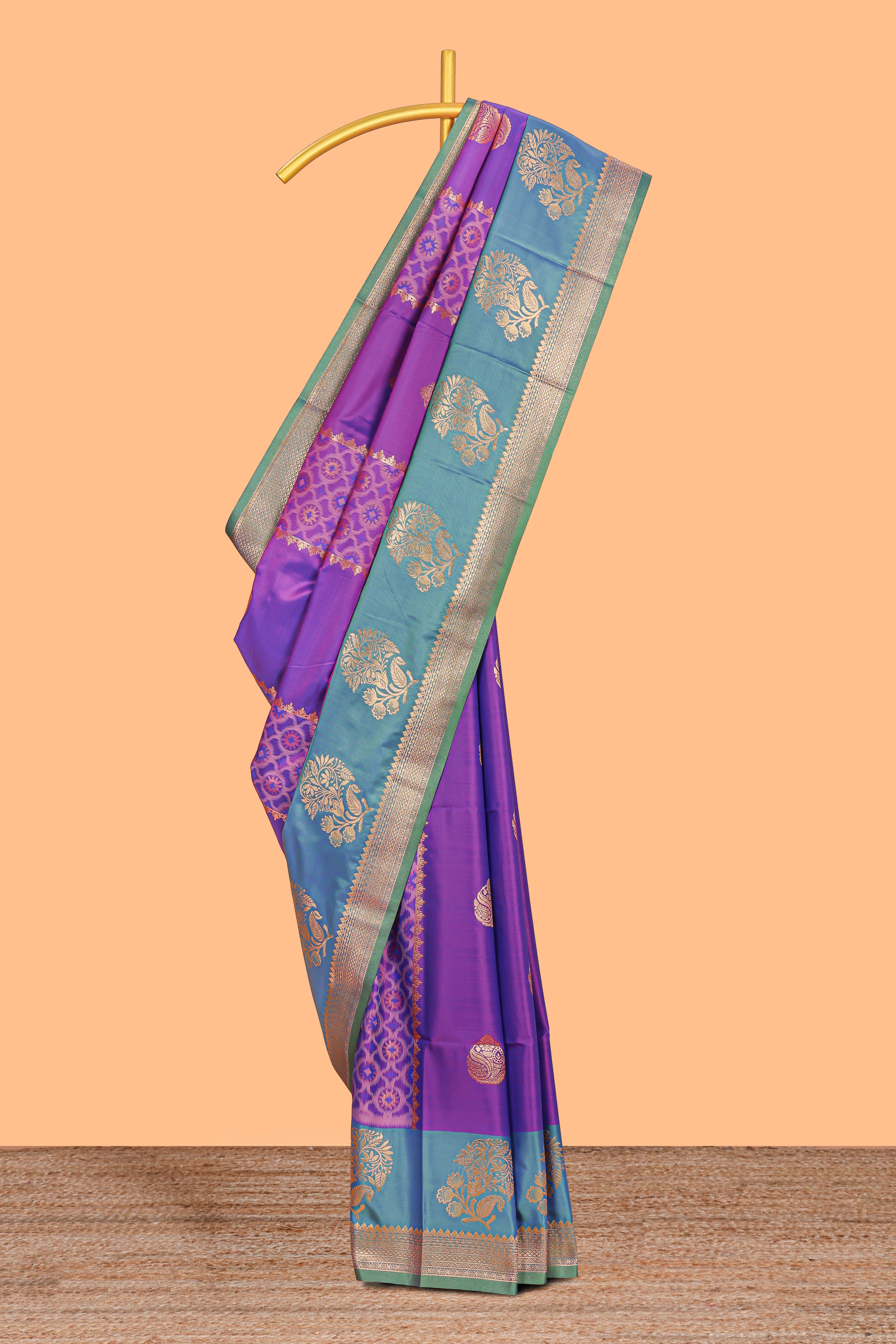 Royal Purple colour semi soft silk Zari-Woven Floral and Peacock Motifs with Gold-Tone Zari border and contrast buttas blouse