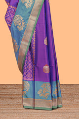 Royal Purple colour semi soft silk Zari-Woven Floral and Peacock Motifs with Gold-Tone Zari border and contrast buttas blouse