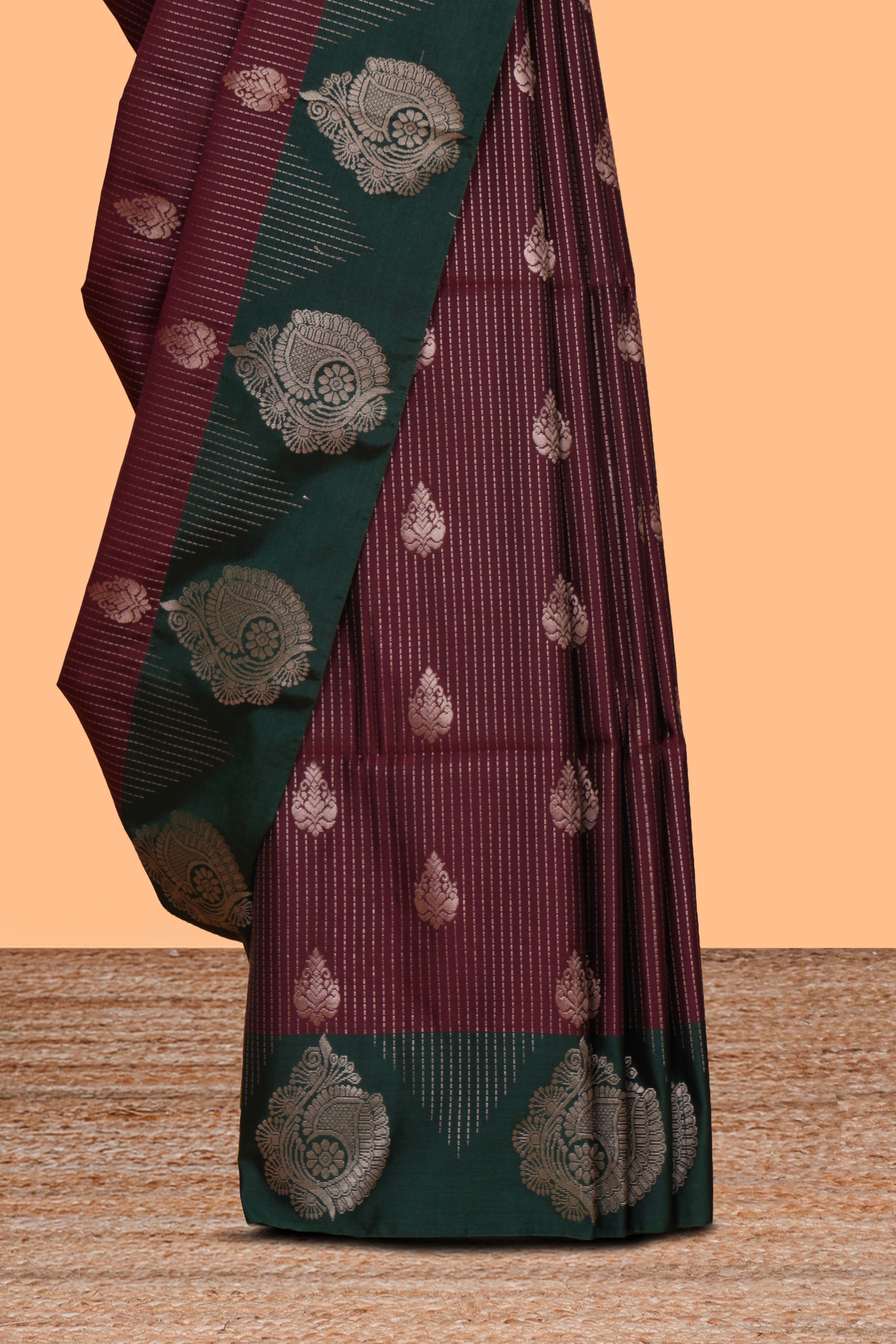 Maroon striped zari motifs design saree with contrast zari border and plain blouse