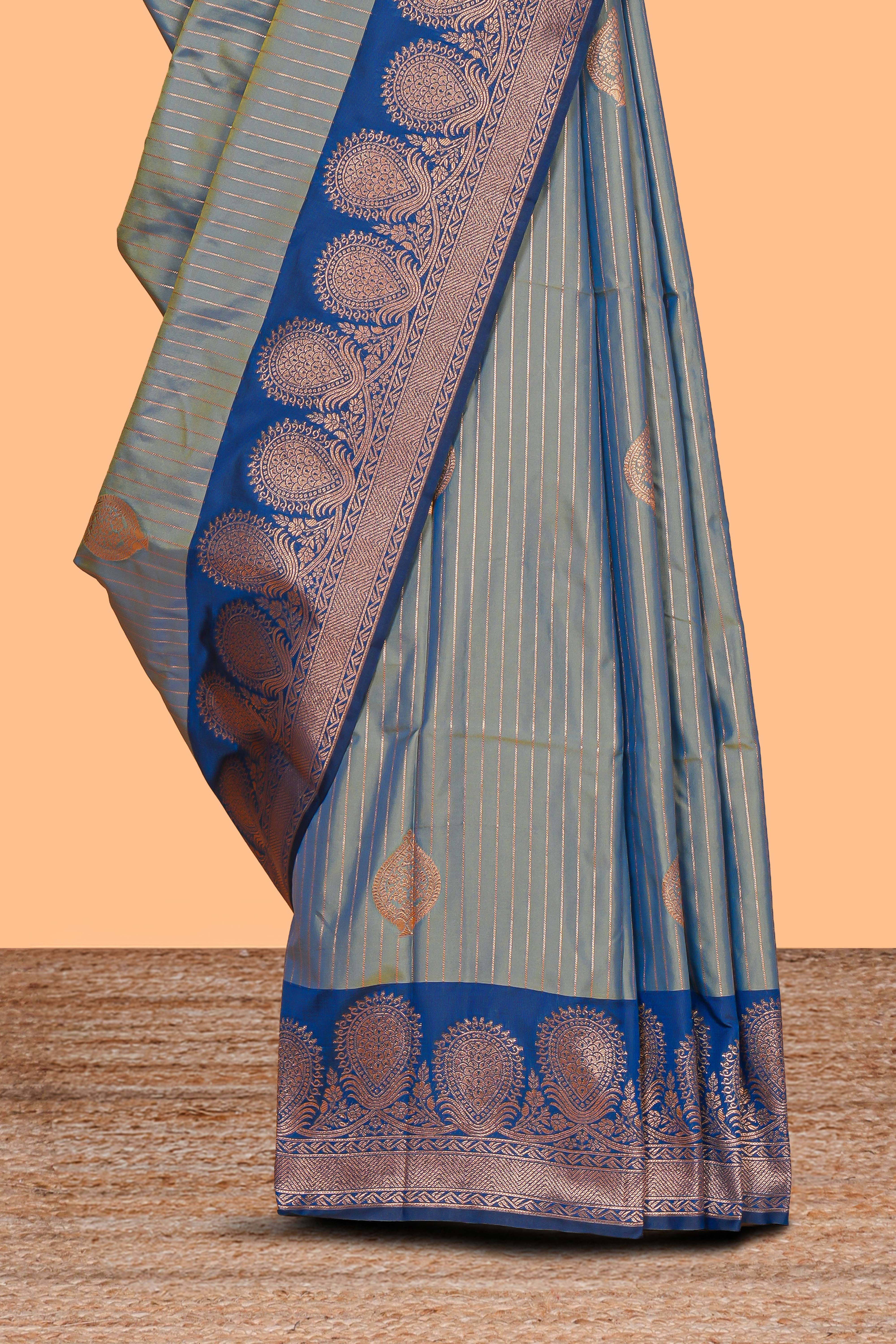 Tempered grey striped zari motifs design semi soft silk saree with contrast zari border and motifs blouse