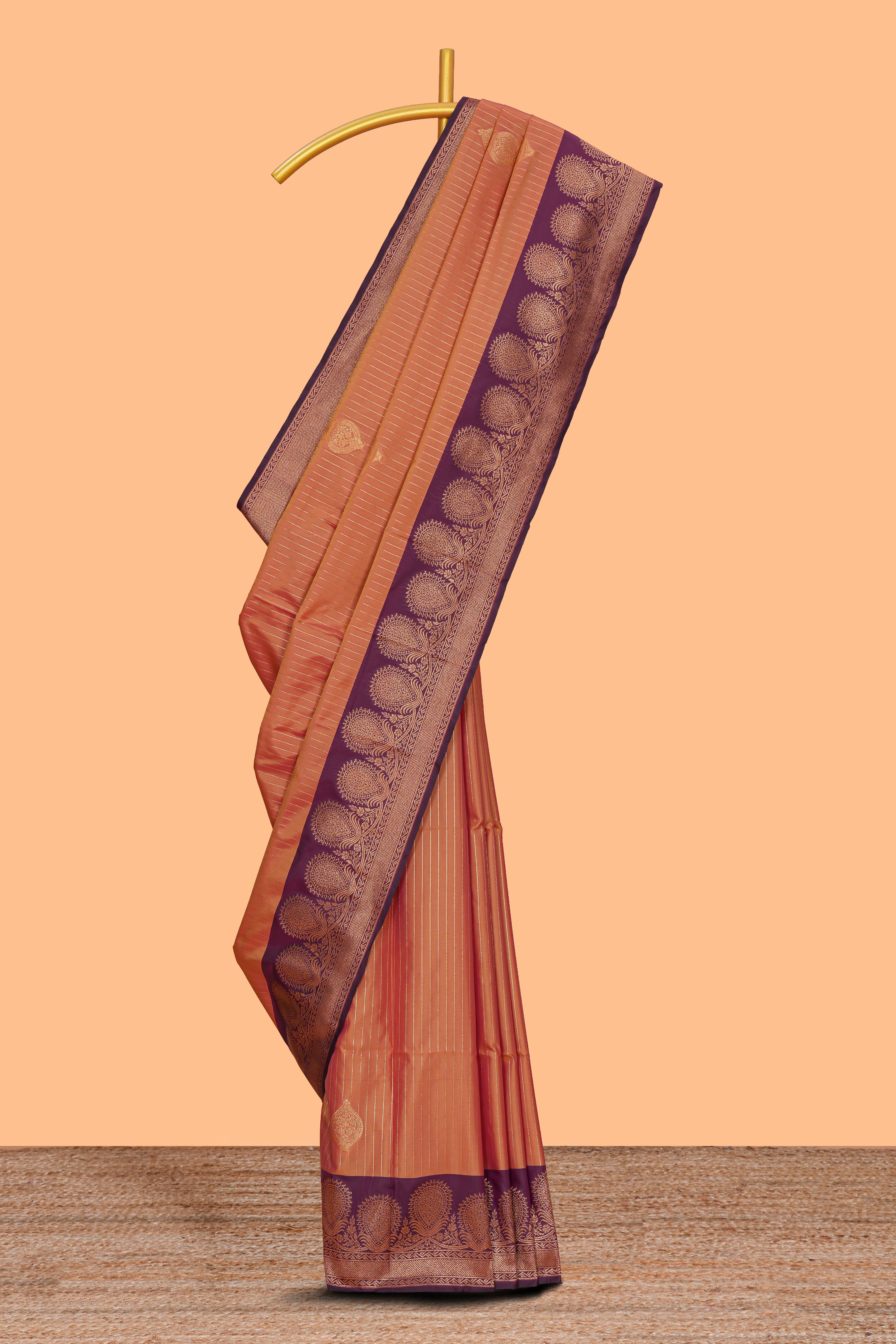 Orange striped zari motifs design semi soft silk saree with contrast zari border and motifs blouse