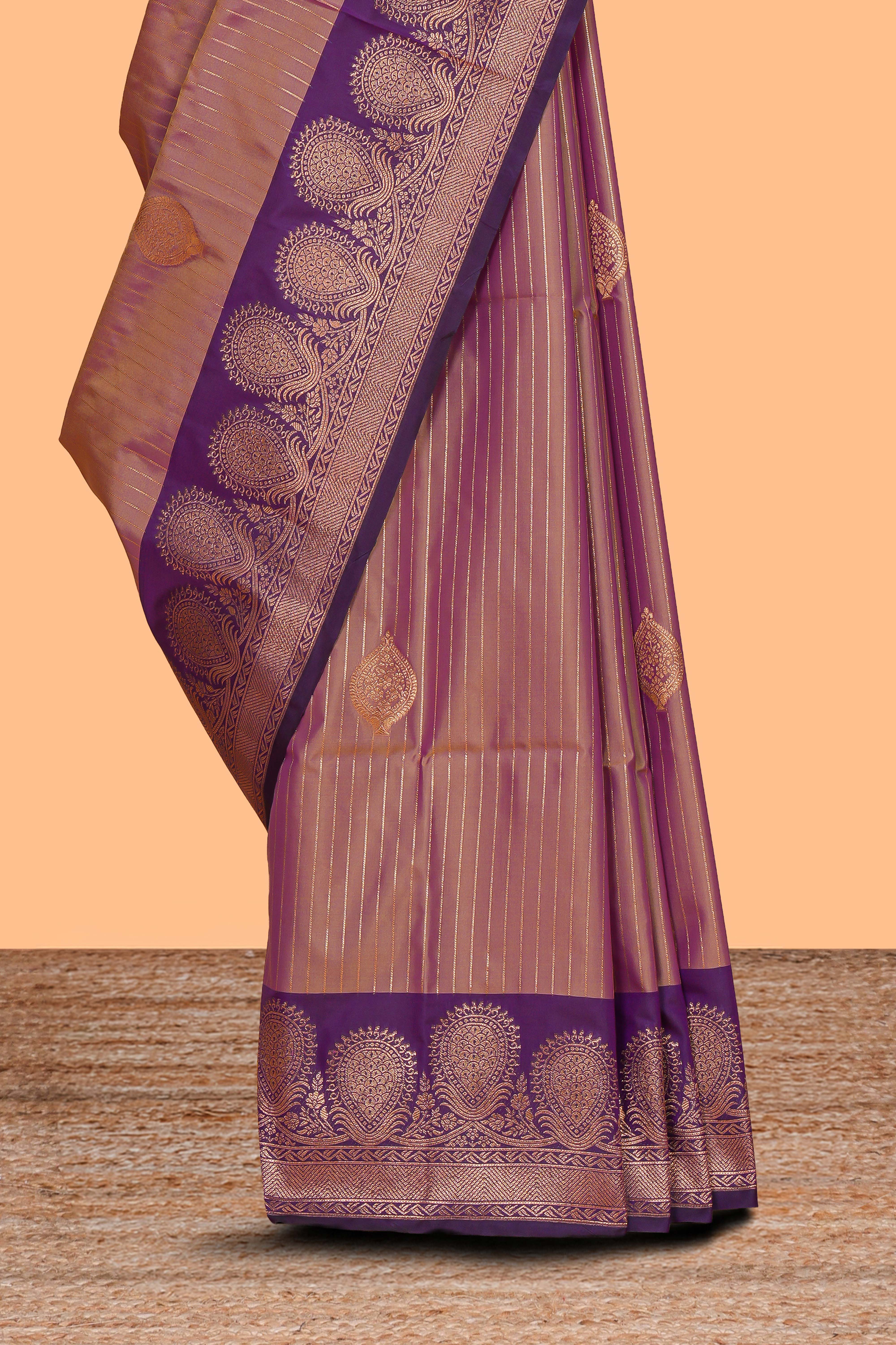 Dark peach striped zari motifs design semi soft silk saree with contrast zari border and motifs blouse