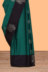 Pine green zari motifs design semi soft silk saree with contrast zari border and plain blouse