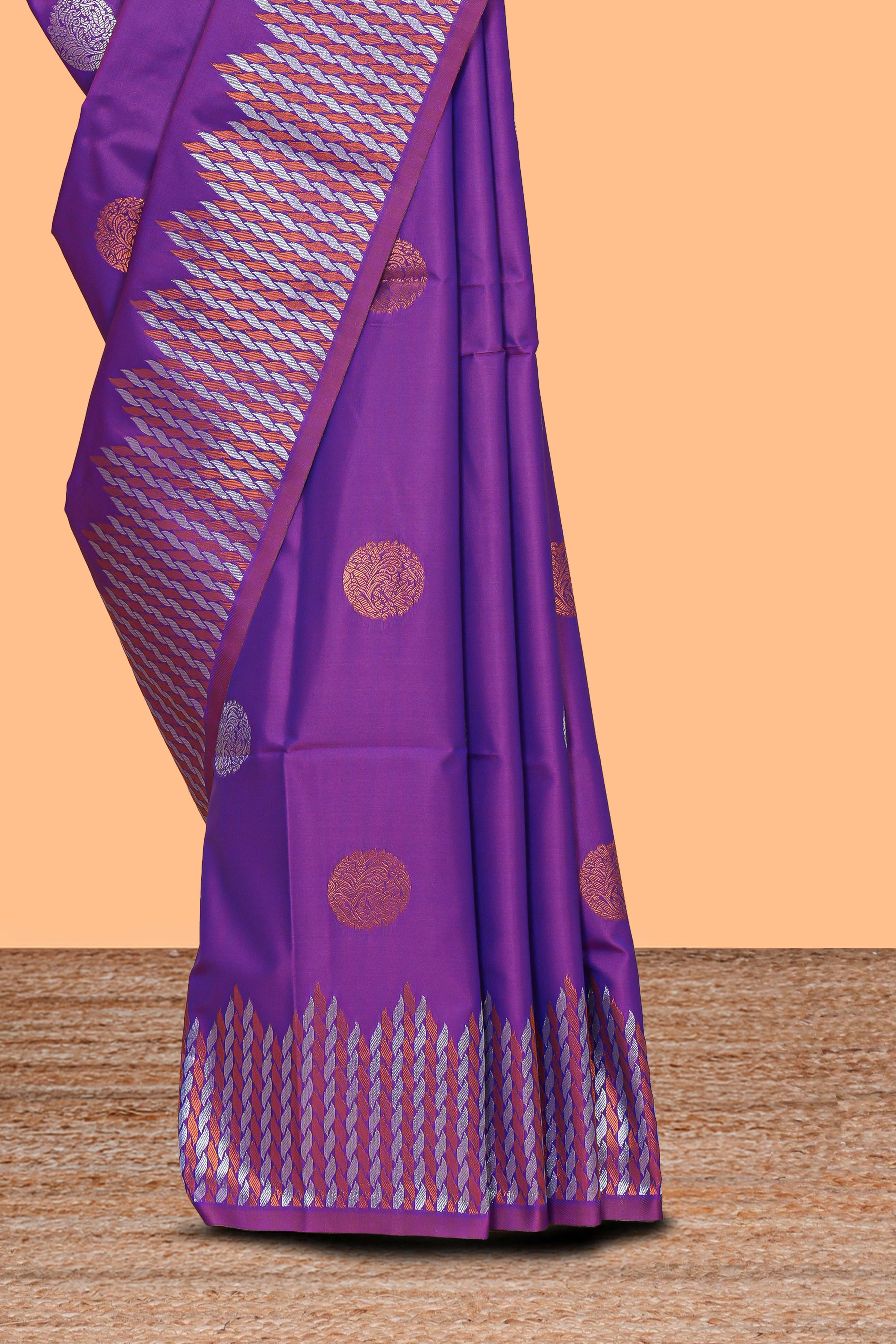 Electric lavender zari motifs design semi soft silk saree with self zari border and contrast motifs blouse