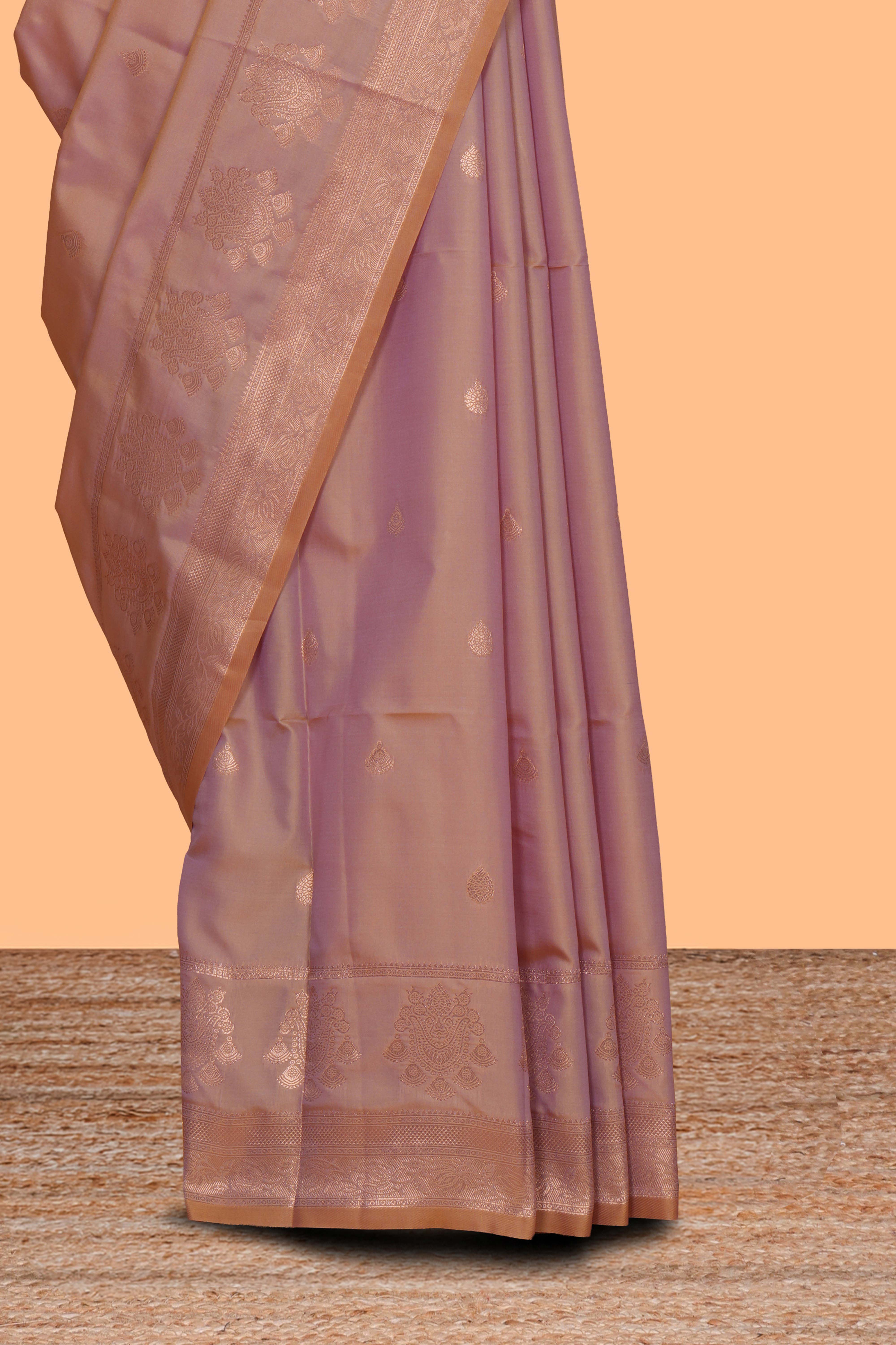 Faded peach zari motifs design semi soft silk saree with self zari border and contrast zari blouse