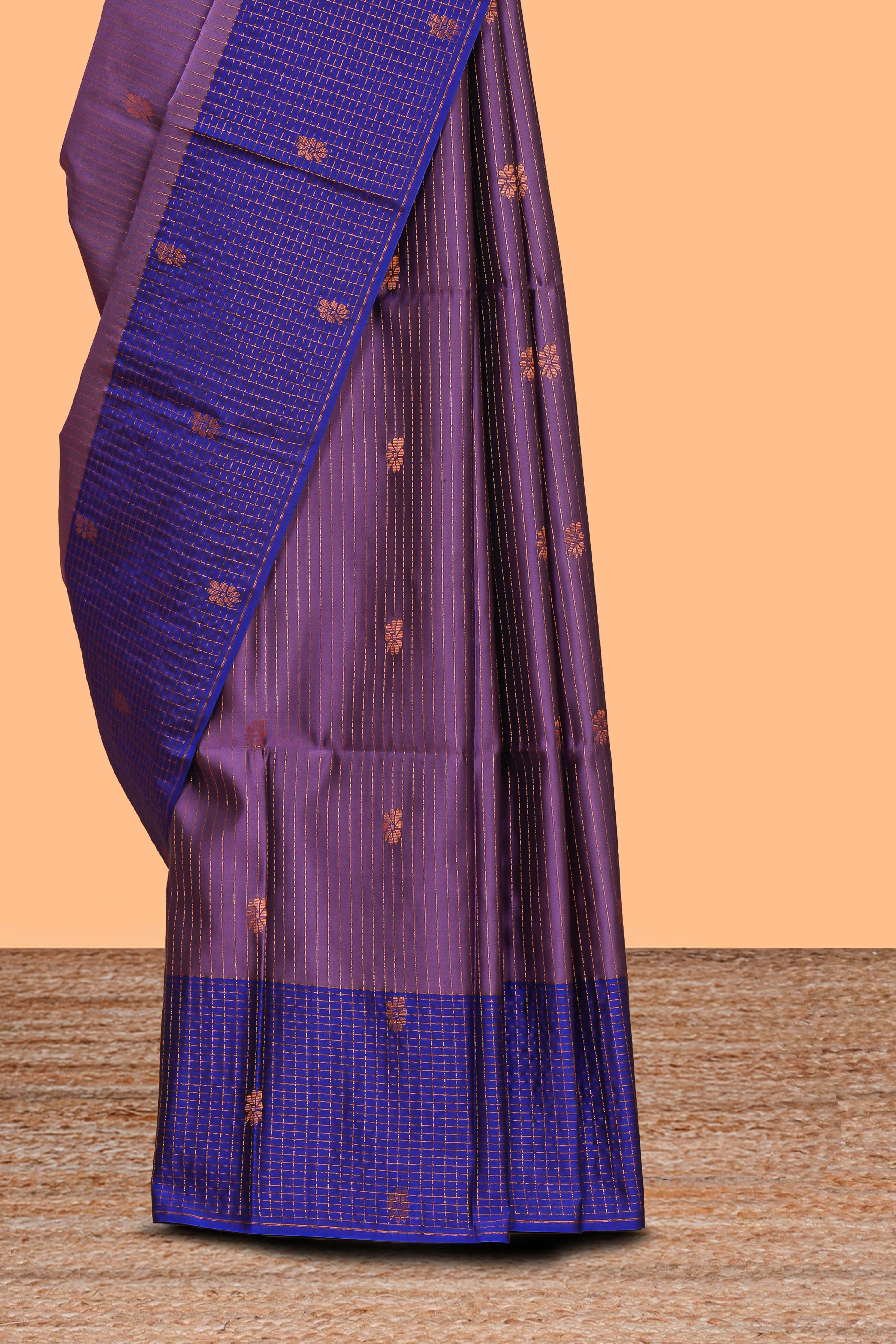 Mauve purple striped zari motifs design semi soft silk saree with contrast checked border andzari striped blouse